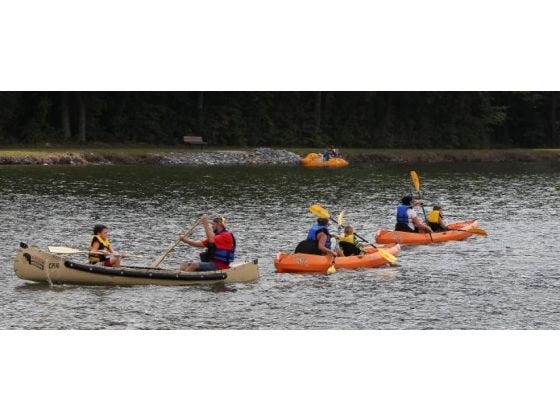 People paddle canoes and kayaks at Rankin Lake Park last weekend.