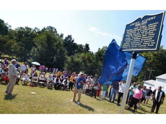 The Lincoln Academy Alumni dedicated a marker in recognition of the former school at the corner of Lincoln Academy Road and C.V.Alexander Drive Saturday morning. Many of the former graduates showed up for the event. Here, the marker is unveiled.