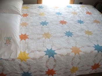 Handmade quilt in use on a bed in the Crews Quarters Overnight Program Building at Whitefish Point, Michigan.