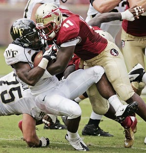 Steve Cannon Associated Press Florida State linebacker Vince Williams (11) stops Wake Forest's Josh Harris during the second quarter of last Saturday's game in Tallahassee.