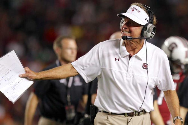 South Carolina head coach Steve Spurrier calls in a play to quarterback Dylan Thompson during the first half of an NCAA college football game against UAB at Williams-Brice Stadium in Columbia, S.C., Saturday, Sept. 15, 2012. (AP Photo/Brett Flashnick)