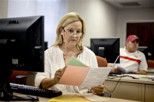 Judy Smith, of Dalton, Ga., looks over paperwork as she files for unemployment. Amarillo's unemployment rate for August is lower than state and national averages.