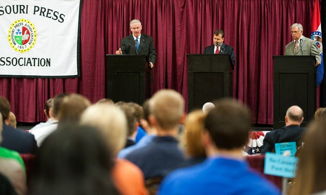 Gubernatorial candidates Democrat Jay Nixon, left, Republican Dave Spence and Libertarian Jim Higgins participate Friday in a Missouri Press Association candidate forum at the Columbia Expo Center.