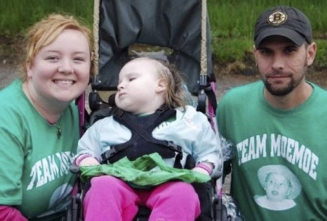 Katie and Jamie Merrill with their daughter Morgan. The family hoped to raise enough money at the event to purchase a wheelchair accessible van.
Courtesy photo