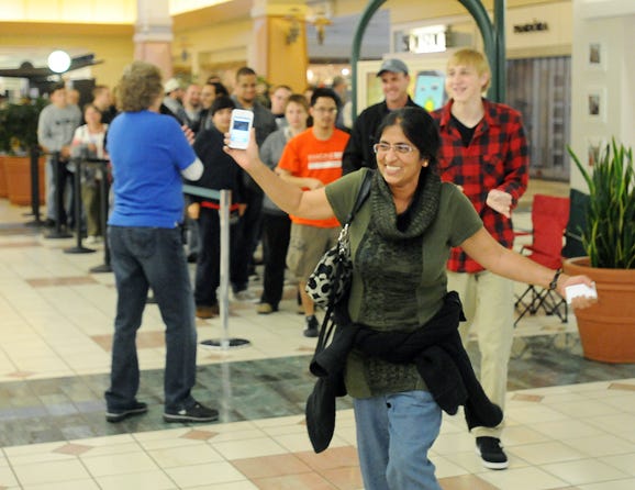 Nalini Raj of Pittsford was the first one into the Apple store on Friday morning to get the new I Phone 5. She started waiting in line on Thursday at 5:30 p.m.