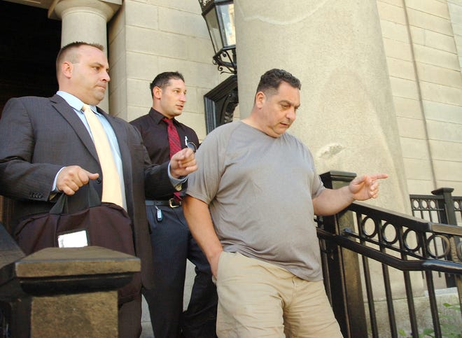 As a result of state drug lab evidence mishandling, David Danieli was released from jail at Norfolk Superior Court in Dedham after a short hearing Thursday, Sept. 20, 2012. He leaves the courthouse with his attorney, John T. Martin.
Gary Higgins/The Patriot Ledger