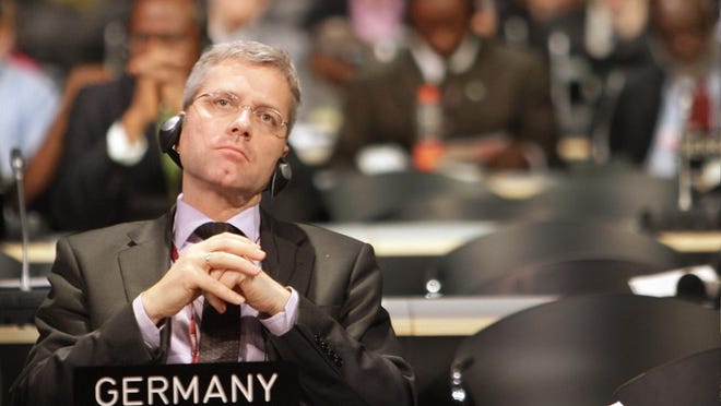 German environment minister Norbert Roettgen listens during a plenary session at the climate summit in Copenhagen on Wednesday. Friday marks the final day of the 12-day talks.