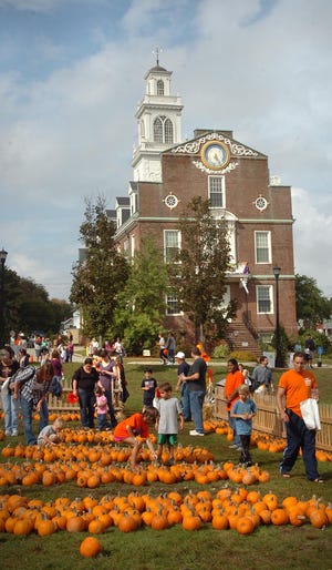 A pumpkin patch outside Town Hall gives residents a chance to select their own pumpkins at the annual fall festival in Weymouth, Saturday, Oct. 1, 2011.