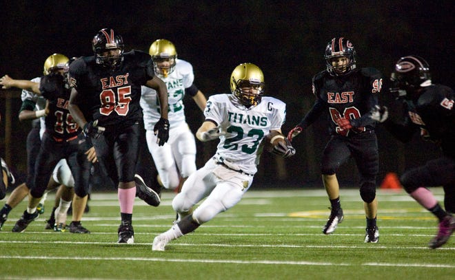 Boylan High School's Danny Appino (23) changes directions for a touchdown run on East in the first quarter Friday, Sept. 21, 2012, during their game at Swanson Stadium in Rockford.