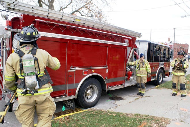 Belvidere Fire Department firefighters and paramedics perform a training drill Monday, Nov. 29, 2010,at 128 W. Locust St., a building owned by the Belvidere Family Y, which is expected to be razed in the coming days.