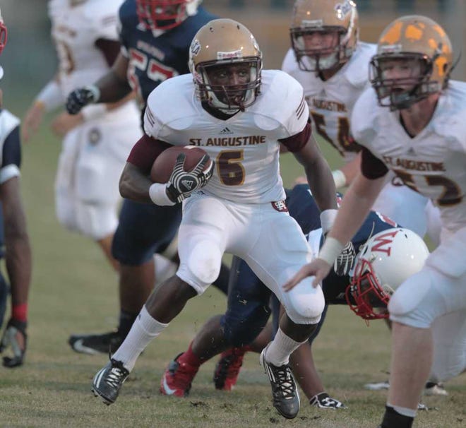 St. Augustine's Levent Sands runs the ball Friday during the first half against Wolfson.