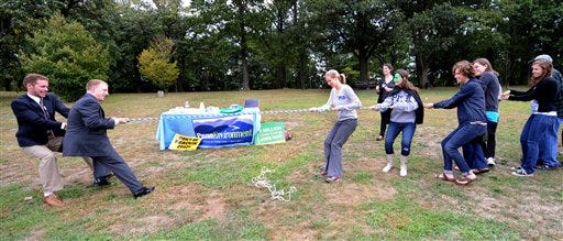 Local groups from Pittsburgh take part in a Frackdown Smackdown tug-of-war between college students representing the "gas industry" and Pennsylvania citizens during a global Frackdown Day Schenley Park in Pittsburgh, Saturday. Anti-fracking protests were held in several places in the U.S. and abroad.