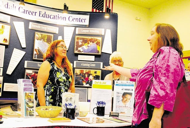 Dianne Sleight, center, health care coordinator of Ulster BOCES, and Coleen Macaluso, left, also of Ulster BOCES, chat with Rose Quinn of the Ulster BOCES Literacy Zone Friday at the Ulster Regional Chamber of Commerce's Buy Local Expo at the SUNY Ulster campus in Stone Ridge.