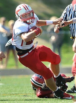 Hudson quarterback Daniel Mendes falls forward for yardage after a Westborough tackle during the second half Saturday.