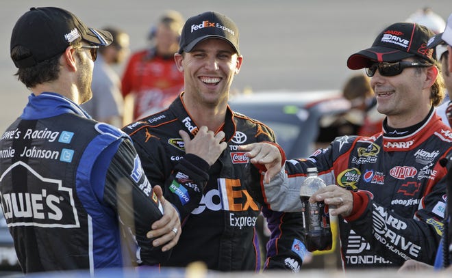 Denny Hamlin (center) will start Sunday's race 32nd after a making a mistake with his tires in qualifying.