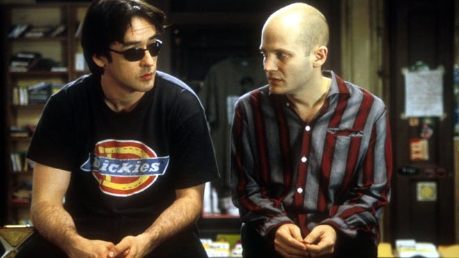 John Cusack, left, and Todd Louiso star in 'High Fidelity,' which is out today on Blu-ray, but there are no new extras.