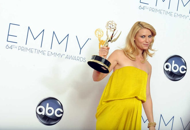 Actress Claire Danes, winner of the Outstanding Lead Actress In A Drama Series award for "Homeland," poses backstage at the 64th Primetime Emmy Awards.