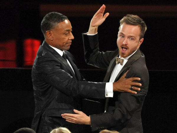 Giancarlo Esposito left congratulates Aaron Paul after Paul won the award for outstanding supporting actor in a drama series for 'Breaking Bad,' at the 64th Primetime Emmy Awards at the Nokia Theatre on Sunday Sept. 23 2012 in Los Angeles. Photo by Associated Press