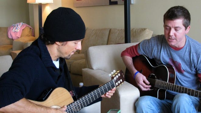 Musican Jason Mraz plays with Texas musician Ray Johnston, who is working as a singer/songwriter after several bouts with leukemia cut short his athletic career.