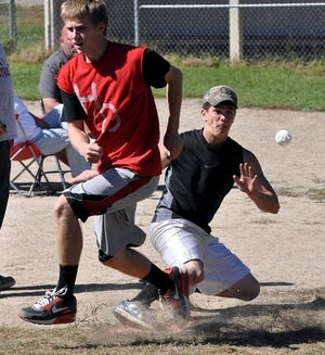 Emily H. Wake/Democrat photo
The Heart Breakers' Luke Roberts, left, safely crosses home plate as Slime Dogs' catcher Micale Vachon tries to control the ball during the Courier Cup Wiffleball Classic Sunday in Farmington.