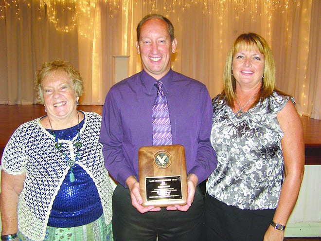 Garon Gembe received the 2012 James P. Oliver Award for his service to the community. He is pictured with his mother Nancy, and wife Julie.