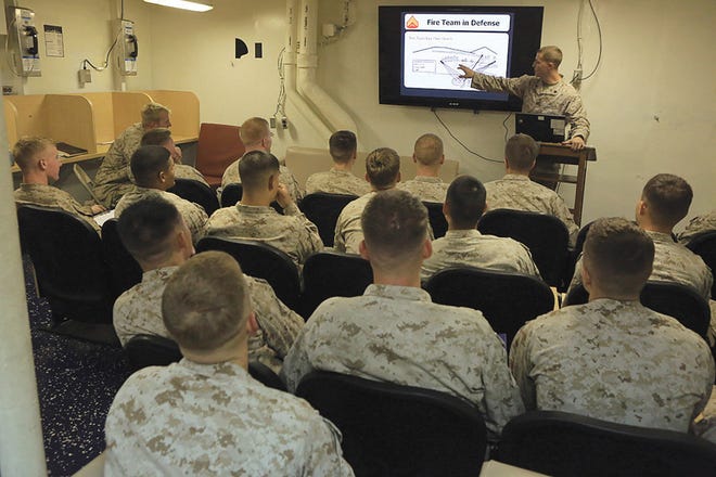 Corporals with the 24th Marine Expeditionary Unit receive a class on infantry tactics aboard the USS Gunston Hall in the Gulf of Aden.