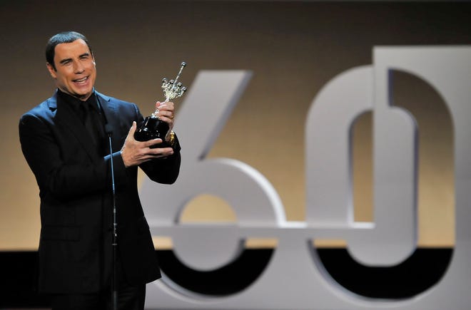 John Travolta, shown accepting the Donostia Award on Sunday in Spain, spoke out against celebrity-privacy invasions last week. (The Associated Press)