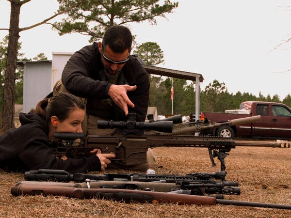 Firearms instructor Chris Costa teaches Ashton Knippenberg the finer points of firing a Barret MRAD .338 Lapua in a scene from “Operation Z.” Photo courtesy of Legion Productions
