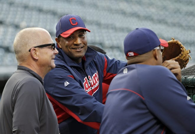 Cleveland Indians interim manager Sandy Alomar Jr. (center) watches batting practice before the Indians' baseball game against the Kansas City Royals on Friday in Cleveland. Alomar takes over for Manny Acta, who was fired Thursday.