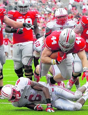 Ohio State's Zach Boren (44) scores a touchdown over Miami of Ohio's D.J. 
Brown during the fourth quarter on Sept. 1, in Columbus, Ohio. Ohio State 
won 56-10. The new FBS playoff system may mean fewer games for Ohio State 
against MAC teams.ASSOCIATED PRESS / NAME