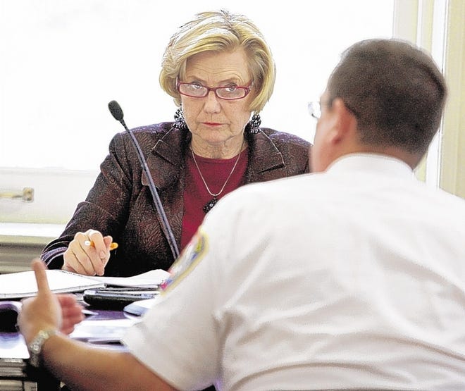 Mayor Judy Kennedy listens to Newburgh Fire Chief Michael Vatter speak to the city council during Thursday eveningís budget meeting discussion at City Hall in Newburgh.