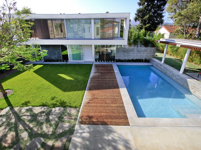 A view of Craig Ehrlich's accessory house, yard and swimming pool, in Santa Monica, August 21, 2012. The original house was awarded an AIA/LA Decade award as one of the best buildings of the last ten years. Ehrlich bought the lot next door and had architects John Friedman and Alice Kimm design this new building, with a pool in between, making a compound with a great outdoor area. This new house is one of the very first that will be certified LEED for Homes in Southern California.