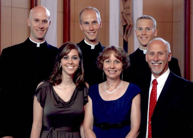 Back from left: Vincent Strand; Luke Strand and Jacob Strand with, front from left: Theresa Krausert; Bernadette Strand and Jerry Strand in Dousman, Wis. The Strand brothers, ranging from 26 to 31, said they all felt their calling to serve the church independently, with no pressure from their parents.