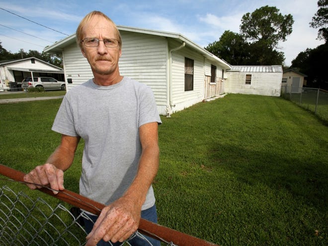 Ernest Albritton's home is steadily sinking into a hole in his front yard in Winter Haven, Fl. Monday September 24, 2012. Albritton's home is cracking all over the place ,floors tilting and his insurance company has denied his claim.