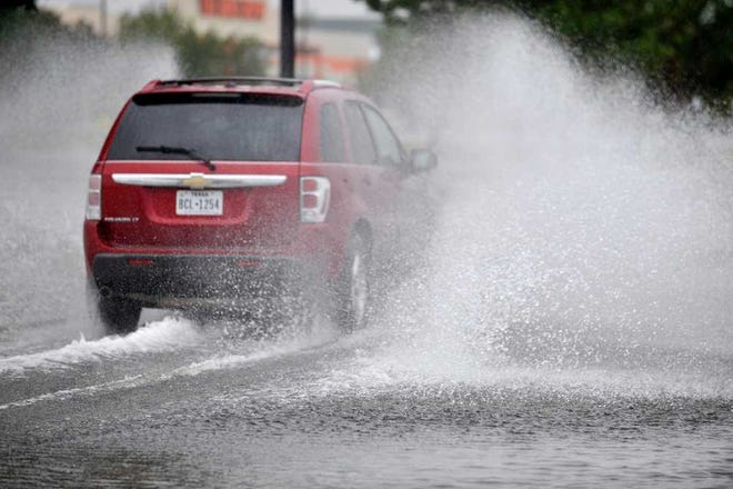 A Chevrolet Equinox drives through a flooded street last month after overnight storms. September was Amarillo's wettest month in more than two years.