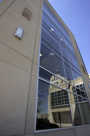 The Register Star News Tower is reflected in the windows of the press hall.