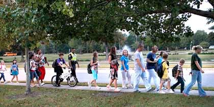 International Walk to School Day left from Jacksonville Commons Recreation center heading to Jacksonville Commons Elementary School on Wednesday morning along with parents, teachers and community leaders in Jacksonville.