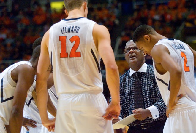 Illinois' associate head coach Wayne McClain talks to the team during a time out against Minnesota during the Illini's Big Ten opener at Assembly Hall Tuesday, Dec. 27, 2011.