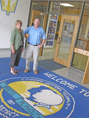 Bristol-Plymouth Principal Carolyn Pearson and Superintendent Richard Gross stand at the school’s main entrance. Beginning this fall, Rehoboth students can attend the vocational school in Taunton. Dighton students may soon follow suit.