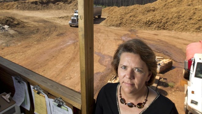 Bastrop County Commissioner Clara Beckett, who represents most of the burn zone, visits one of the two county disposal sites for concrete waste from homes and mulched trees.