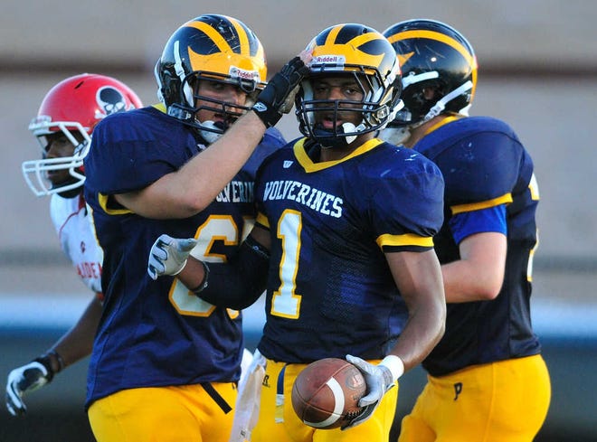 Prince Avenue's Wesley Bridgham, left, congratulates Prince Avenue's Carl Mattox on his first quarter touchdown as Prince Avenue takes on Savannah Christian at Brad Akins field on Friday, Sept. 7, 2012. Richard Hamm/Staff