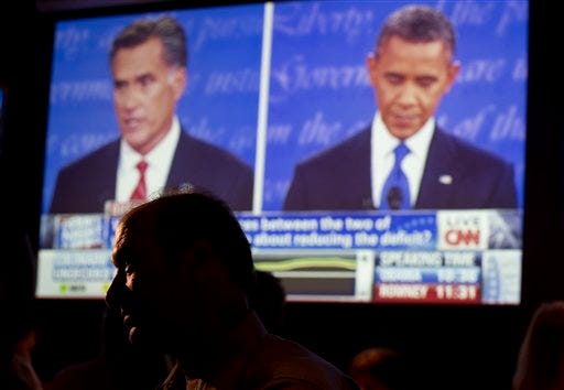 John Rossitto watches the first presidential debate between President Barack Obama and Republican presidential nominee Mitt Romney from a restaurant Wednesday in San Diego.