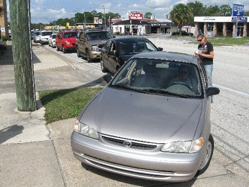 Jesse Mobley's Toyota was first in line for $1.84-a-gallon fuel Thursday at the WBOB-AM "Gas We Can" promotion at a Beach Boulevard Citgo. Mobley waited there for two hours.