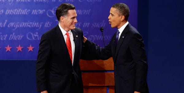 President Barack Obama and Republican presidential candidate Mitt Romney talk at the end of the first presidential debate in Denver on Wednesday evening.