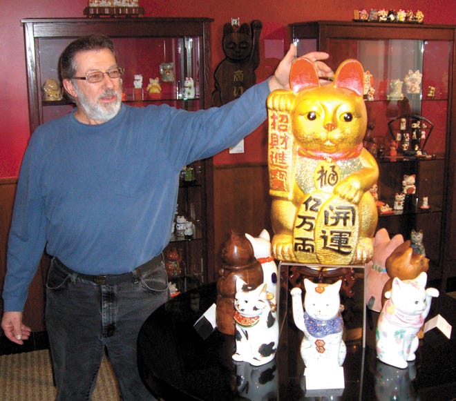 Fred Pisani, manager of the Feline Historical Museum in Alliance, explains the museum’s current featured exhibition, the Maneki Neko Collection of “lucky cats.” The special exhibit is on display through Oct. 31.