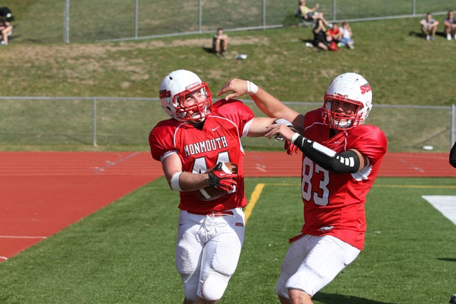 Monmouth College's Trey Yocum celebrates a touchdown in the end zone.