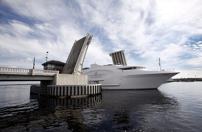 The 228-foot mega-yacht SeaFair passes through Alfred Cunningham Bridge on Friday. The yacht serves as a floating art museum, and will be in New Bern as part of the 2012 Mumfest, which will be held on October 13 to 14.