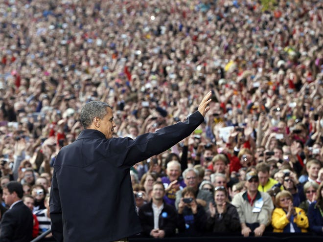 President Barack Obama waves to supporters as he takes the stage during a campaign event at the University of Wisconsin-Madison, Thursday, Oct. 4, 2012, in Madison, Wis. (AP Photo/Pablo Martinez Monsivais)