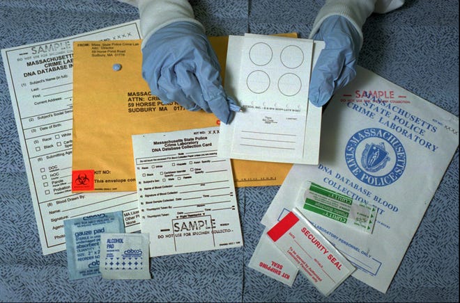 Mary Kate McGilvray, a serologist/DNA analyst at the Massachusetts State Police Crime Lab, displays a sample kit of the type used to collect blood samples for the state's DNA database of people convicted of certain crimes, at the crime lab in Sudbury, Mass., Thursday, Jan. 29, 1998. A new law, which went into effect Jan. 1, requires anyone convicted of any of 33 crimes, ranging from prostitution to murder, to give a blood sample. A group of prisoners is suing the state challenging the constitutionality of the law.