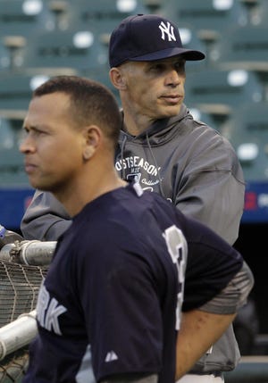 New York Yankees manager Joe Girardi, right, and third baseman Alex Rodriguez take part in baseball practice on Saturday, Oct. 6, 2012, in Baltimore. The Yankees and the Baltimore Orioles are scheduled to play Game 1 in the American League division series on Sunday. ()